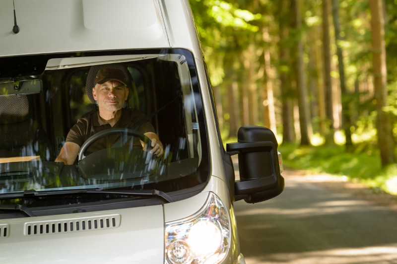 Expediter Driving Through the Woods to Make Delivery